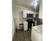 Efficient kitchen with white cabinets and gas range at 534 Hamilton E Holmes Dr, Atlanta, GA 30318