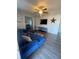 Spacious living room featuring a sectional sofa and large TV at 534 Hamilton E Holmes Dr, Atlanta, GA 30318