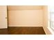 Attic room with hardwood floors and a window at 7940 White Oak Loop, Lithonia, GA 30038