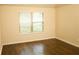 Bedroom with wood-look floors and a window at 7940 White Oak Loop, Lithonia, GA 30038