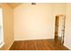 Bedroom with high ceilings, wood-look floors, and natural light at 7940 White Oak Loop, Lithonia, GA 30038