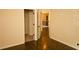 Bedroom featuring wood-look floors and a closet at 7940 White Oak Loop, Lithonia, GA 30038