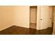 Bedroom featuring wood-look floors and a closet at 7940 White Oak Loop, Lithonia, GA 30038