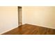 Bedroom featuring wood-look floors, neutral walls, and a closet at 7940 White Oak Loop, Lithonia, GA 30038