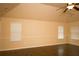Spacious bedroom with ceiling fan, hardwood floors, and plenty of natural light at 7940 White Oak Loop, Lithonia, GA 30038