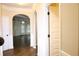 Elegant entryway with hardwood floors and arched doorways leading to the living spaces at 7940 White Oak Loop, Lithonia, GA 30038