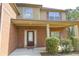 Inviting front porch with brick columns and space for seating, offering a warm welcome at 7940 White Oak Loop, Lithonia, GA 30038