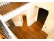 Hallway with stylish wood floors, black iron railing, and detailed trim at 7940 White Oak Loop, Lithonia, GA 30038