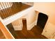 Hallway with stylish wood floors, black iron railing, and detailed trim at 7940 White Oak Loop, Lithonia, GA 30038
