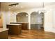 An open kitchen flows into dining and living spaces, featuring granite countertops at 7940 White Oak Loop, Lithonia, GA 30038