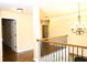 Upstairs landing with wood floors and a chandelier at 7940 White Oak Loop, Lithonia, GA 30038