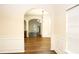A bright, open-concept living space with hardwood floors, arched doorways, and natural light at 7940 White Oak Loop, Lithonia, GA 30038