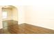 A spacious living room boasts hardwood floors and classic wainscoting, offering warmth and style at 7940 White Oak Loop, Lithonia, GA 30038
