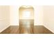 A spacious living room boasts hardwood floors and classic wainscoting, offering warmth and style at 7940 White Oak Loop, Lithonia, GA 30038