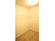 An empty walk-in closet with carpeted floors and a built-in shelf ready to be organized at 7940 White Oak Loop, Lithonia, GA 30038