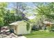 Large backyard with mature trees and a detached building at 2076 W Flat Shoals Ter, Decatur, GA 30034