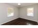 Well-lit bedroom featuring dark hardwood floors and neutral walls at 2076 W Flat Shoals Ter, Decatur, GA 30034