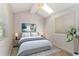 Bright bedroom with vaulted ceiling, large windows, and neutral decor at 2076 W Flat Shoals Ter, Decatur, GA 30034