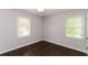 Well-lit bedroom featuring dark hardwood floors and neutral walls at 2076 W Flat Shoals Ter, Decatur, GA 30034
