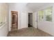 Bedroom with carpet, neutral walls, and private bathroom access at 2076 W Flat Shoals Ter, Decatur, GA 30034
