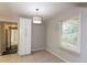 Dining area with white cabinets and tile flooring at 2076 W Flat Shoals Ter, Decatur, GA 30034