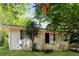 Ranch style home with green shutters and a well-manicured lawn at 2076 W Flat Shoals Ter, Decatur, GA 30034
