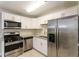 Updated kitchen, stainless steel appliances, granite countertops, white cabinets at 2076 W Flat Shoals Ter, Decatur, GA 30034