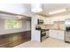 Updated kitchen featuring white cabinets and stainless steel appliances at 2076 W Flat Shoals Ter, Decatur, GA 30034