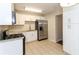 Modern kitchen with stainless steel appliances and white cabinets at 2076 W Flat Shoals Ter, Decatur, GA 30034
