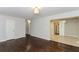Open concept living space with hardwood floors and access to dining area at 2076 W Flat Shoals Ter, Decatur, GA 30034