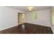 Spacious living room with hardwood floors and large windows at 2076 W Flat Shoals Ter, Decatur, GA 30034