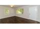 Living room featuring hardwood floors and large windows at 2076 W Flat Shoals Ter, Decatur, GA 30034