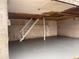 Unfinished basement with painted concrete floor and staircase at 4345 Wellington Pl, Cumming, GA 30040