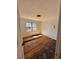 Bedroom with hardwood flooring, window, and lighting fixture at 4345 Wellington Pl, Cumming, GA 30040
