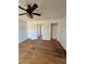Spacious bedroom with hardwood floors, ceiling fan, and neutral paint at 4345 Wellington Pl, Cumming, GA 30040