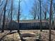 Charming single-story home with a stone foundation and mature trees in a peaceful setting at 4345 Wellington Pl, Cumming, GA 30040