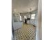 Kitchen features a white appliances, tiled floor, and ample cabinet space at 4345 Wellington Pl, Cumming, GA 30040