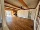 Spacious living room with hardwood floors, a stone fireplace, and sliding doors at 4345 Wellington Pl, Cumming, GA 30040