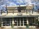 Exterior view of Pure Taqueria, featuring a rooftop patio and modern design at 112 Winsome Way, Woodstock, GA 30188