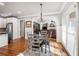 A dining room with hardwood flooring, chandelier, and a view into the living room at 192 Chicopee Ne Dr, Marietta, GA 30060
