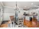 This dining area has neutral walls, hardwood flooring and a view to the kitchen at 192 Chicopee Ne Dr, Marietta, GA 30060