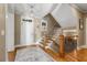 Foyer with staircase, wood floors, and white front door with sidelight window at 192 Chicopee Ne Dr, Marietta, GA 30060