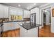 Bright eat-in kitchen with an island, stainless steel appliances, and hardwood floors at 192 Chicopee Ne Dr, Marietta, GA 30060