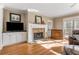Bright living room featuring hardwood floors, fireplace, and built-in cabinets for media at 192 Chicopee Ne Dr, Marietta, GA 30060