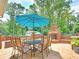 Outdoor patio with a brick fireplace and dining area at 192 Chicopee Ne Dr, Marietta, GA 30060