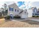 Two-story house with a two-car garage and manicured lawn at 6005 Pattingham Dr, Roswell, GA 30075