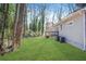 Private backyard with lush grass and mature trees at 3404 Mount Olive Rd, Atlanta, GA 30344