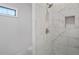 Updated bathroom with a large walk-in shower and marble tile at 3404 Mount Olive Rd, Atlanta, GA 30344