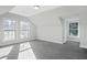 Well-lit bedroom, featuring grey carpet and multiple windows at 3404 Mount Olive Rd, Atlanta, GA 30344