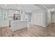 Modern kitchen features white cabinets, stainless steel appliances, and a large island at 3404 Mount Olive Rd, Atlanta, GA 30344